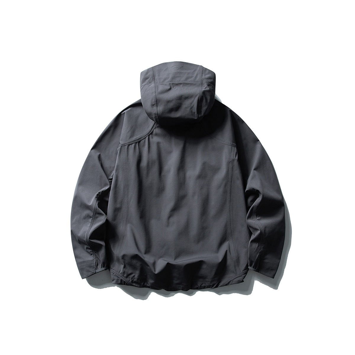 Back view of a charcoal gray hooded jacket with panel seams and long sleeves, laid flat against a white background.