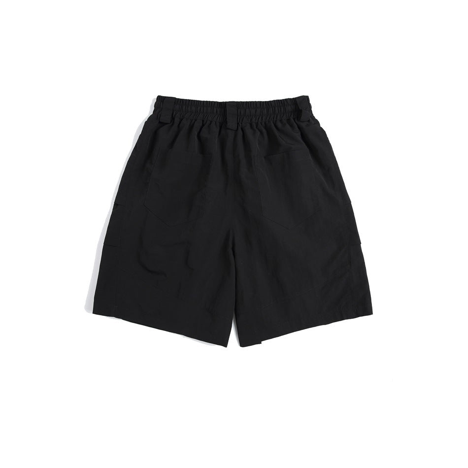 Black knee-length shorts back view with elastic waistband, two back patch pockets and side cargo pocket