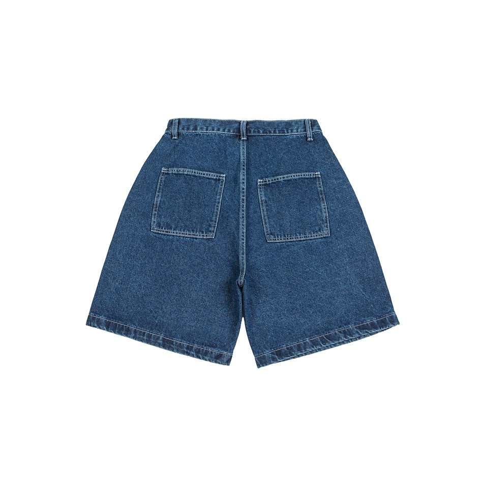 Back view of dark blue denim shorts with two square patch pockets and wide legs.