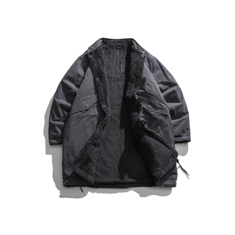 Gray mid-length stand-collar jacket laid flat open, showing dark fleece-like interior and flap pockets