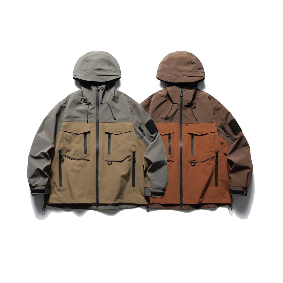 Two hooded utility jackets shown from the front in gray and tan, and brown and rust colorways.