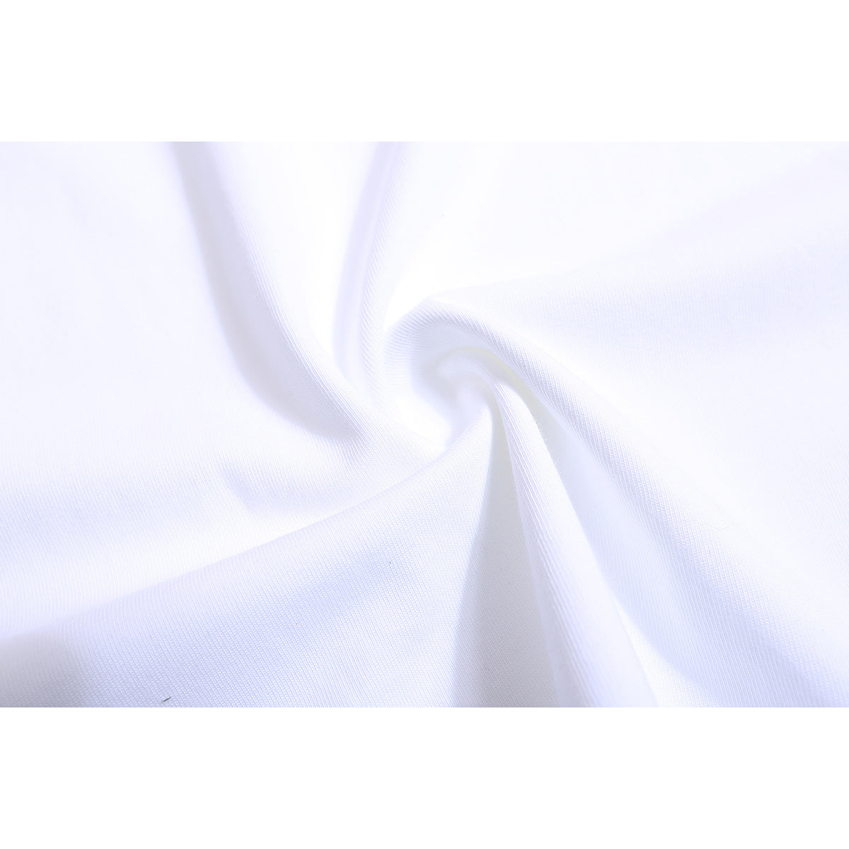 Close-up of white fabric twisted to show its fine knit texture.