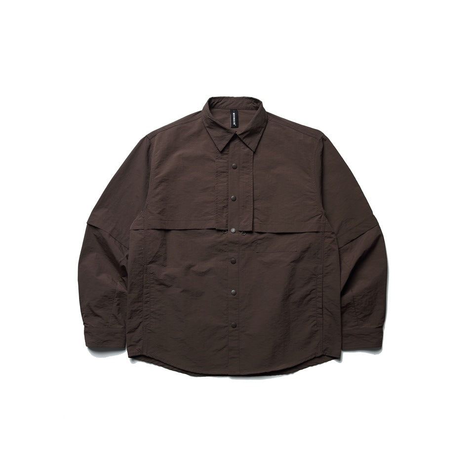 Brown long-sleeve snap-front shirt jacket with layered chest panel and chest pocket, flat lay on white