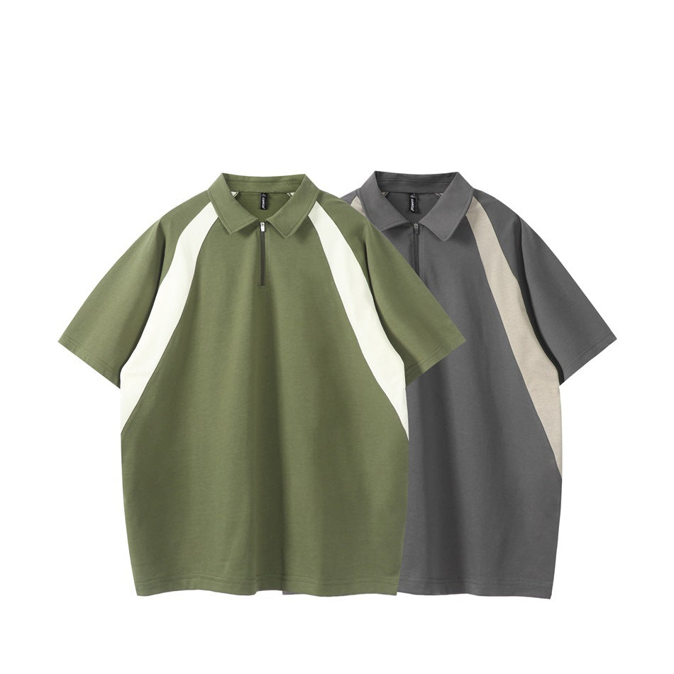 Two short-sleeve collared shirts shown from the front: olive with white panels and charcoal with beige panels.