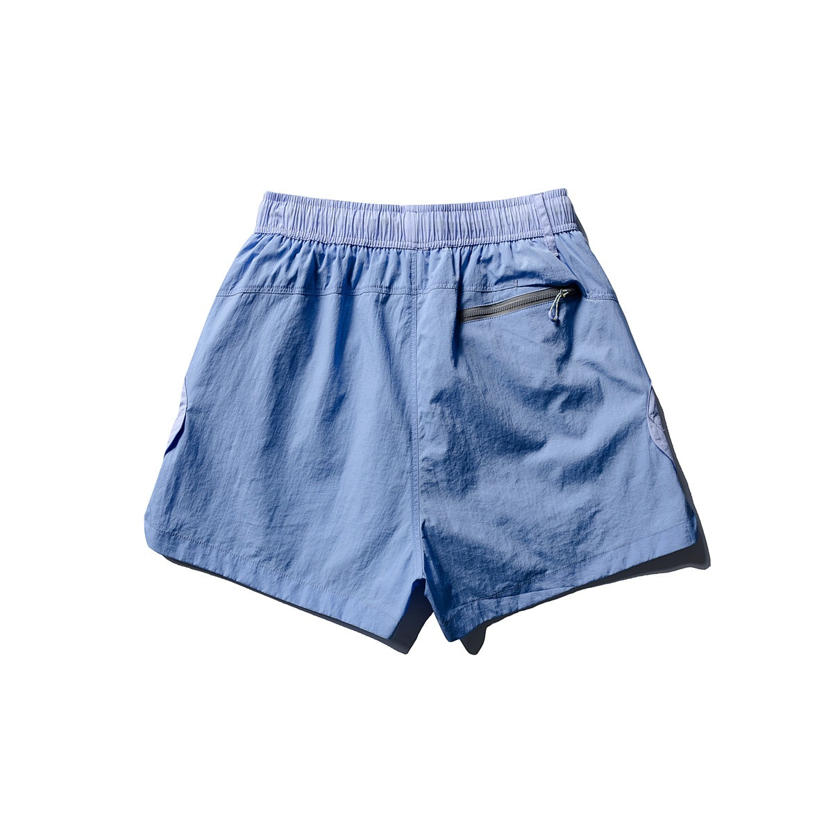 Back view of light blue shorts with an elastic waistband and a zippered rear pocket.