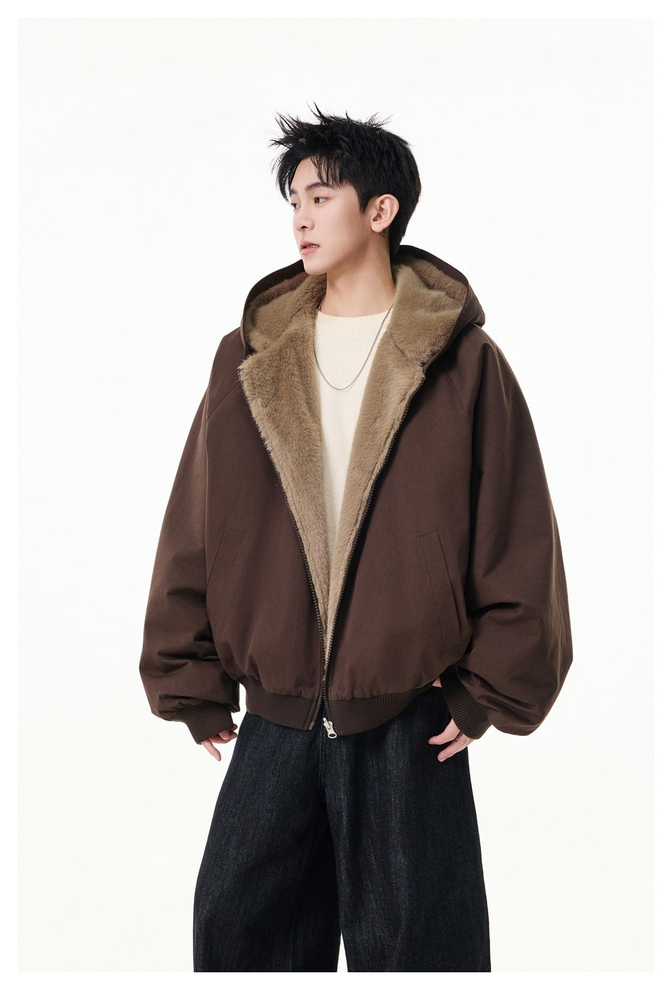 Model wearing an open dark brown hooded jacket with tan plush lining, front pockets, and ribbed cuffs and hem.