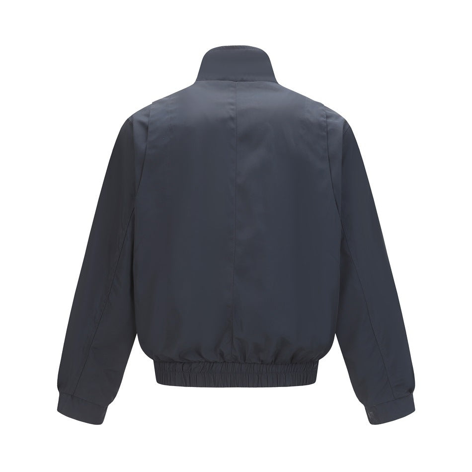 Back view of a dark charcoal jacket with a stand collar, long sleeves, and an elasticated hem.