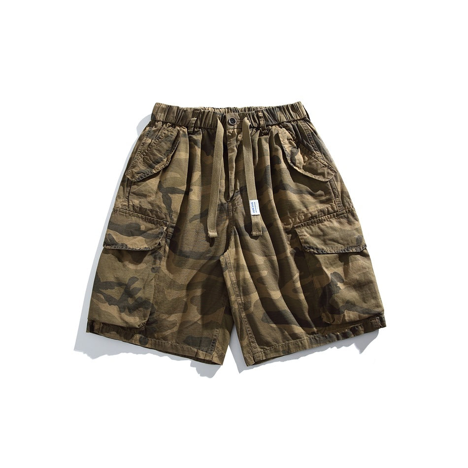 Khaki camouflage cargo shorts with elastic drawstring waist and large flap pockets, front view