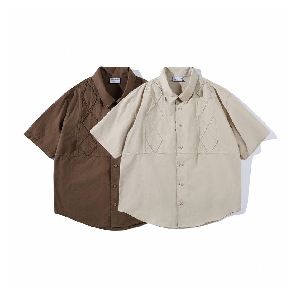 Two short-sleeve button-up shirts with geometric stitched panels, one brown and one light beige.