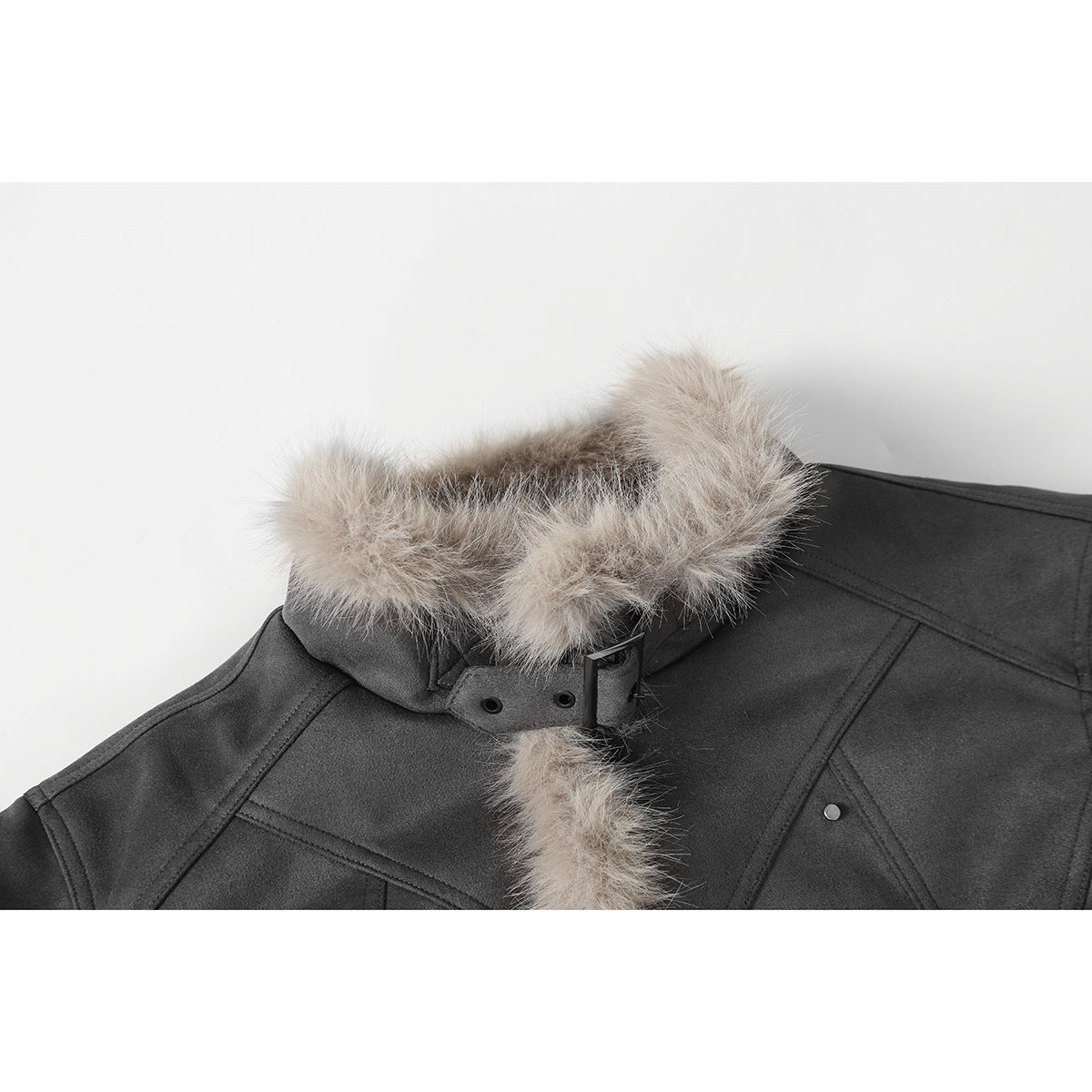 Close-up of a charcoal jacket collar with pale beige fluffy trim, a buckle strap, and stitched panels.