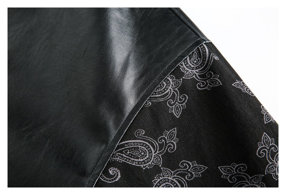 Close-up showing a black jacket panel beside black fabric with a light paisley print.