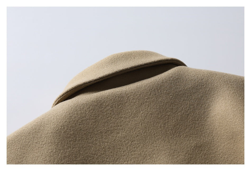 Close-up of the beige coat's collar and upper back.
