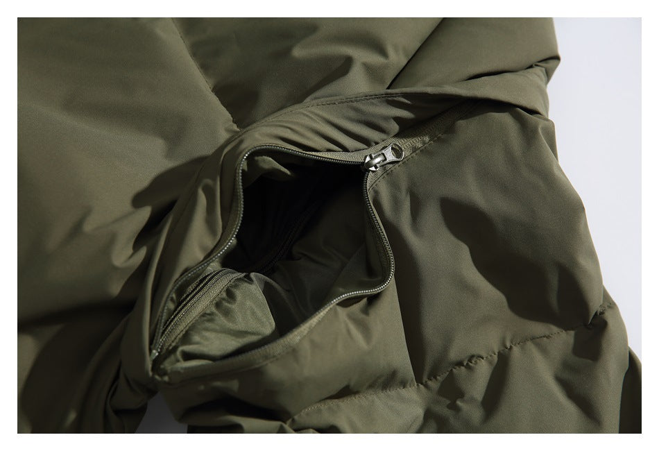 Close-up of an open zipper pocket on an olive-green padded garment.