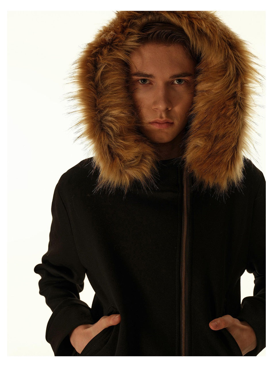 Close view of a black jacket's large brown fur-trimmed hood and front zipper, worn by a model.