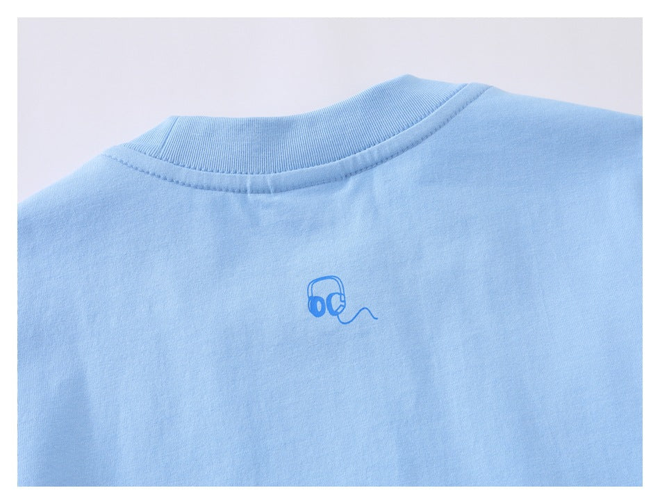 Close-up of the upper back of a light blue shirt with a small headphone-and-cord graphic below the ribbed collar.