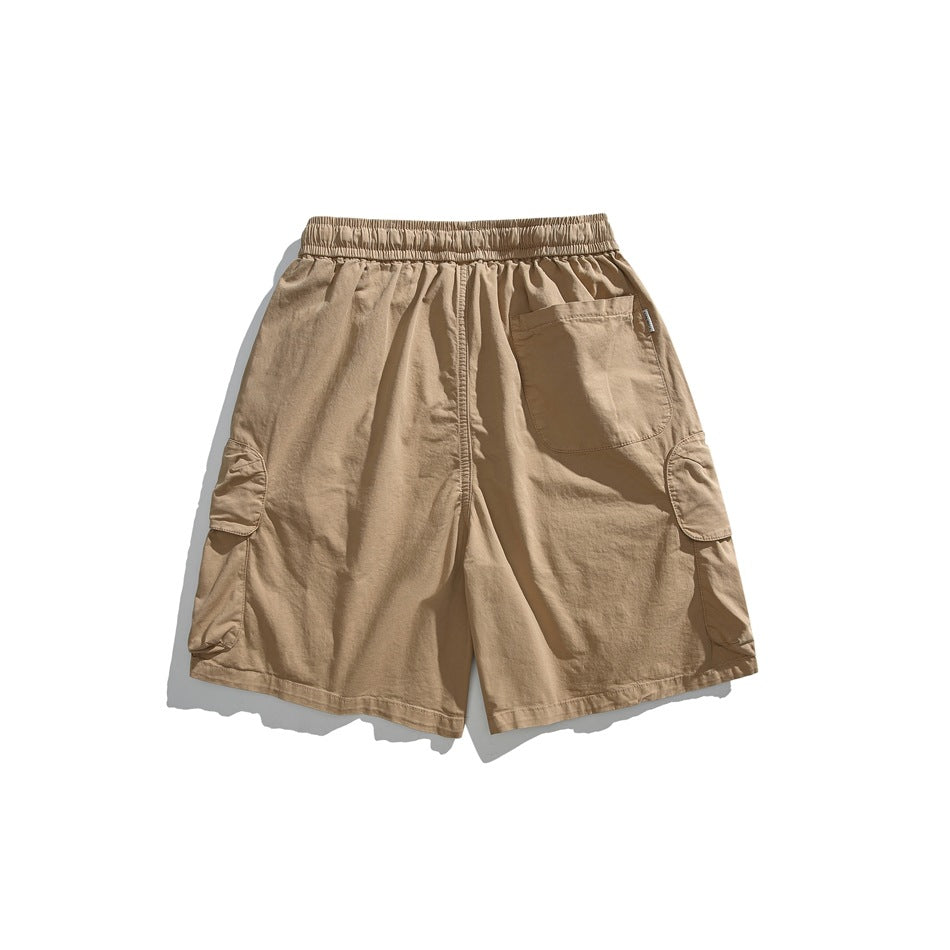 Tan cargo shorts shown from the back, with an elastic waistband, rear pocket, and flap cargo pockets.