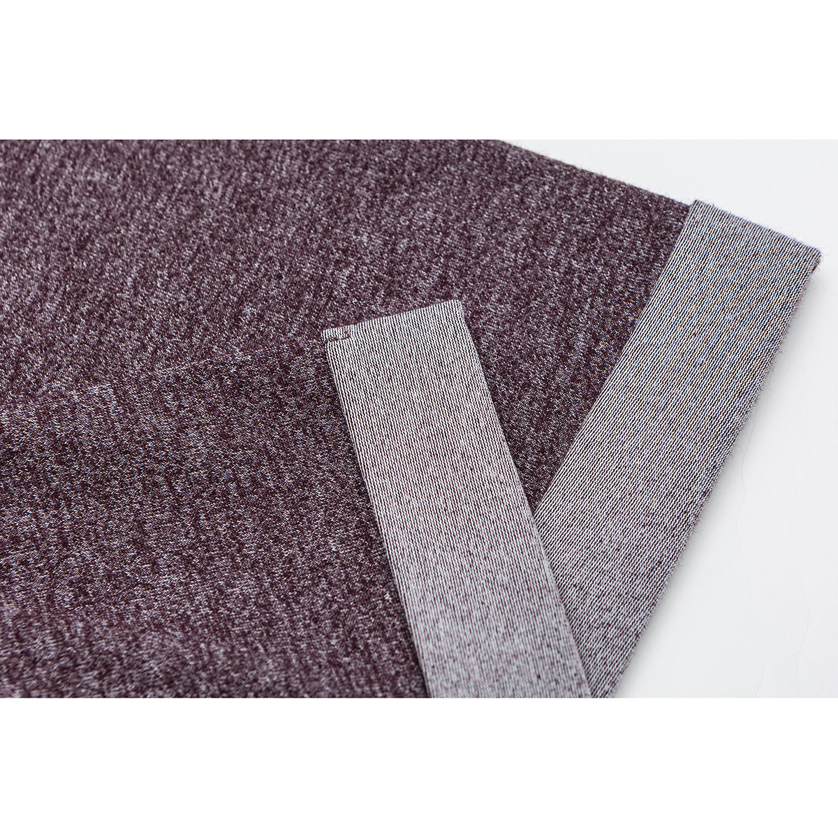 Close-up of a heather burgundy T-shirt sleeve with a wide light-gray turned cuff.