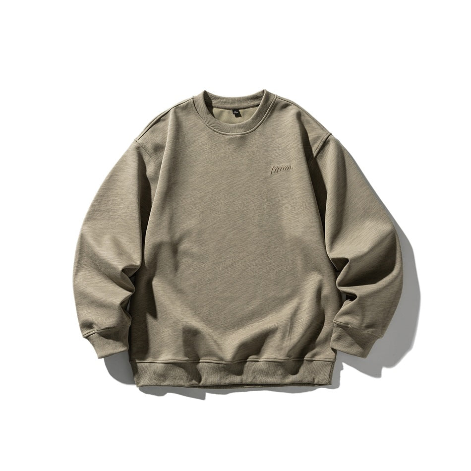 Front view of a taupe crewneck sweatshirt with ribbed cuffs and hem and small tonal chest embroidery.