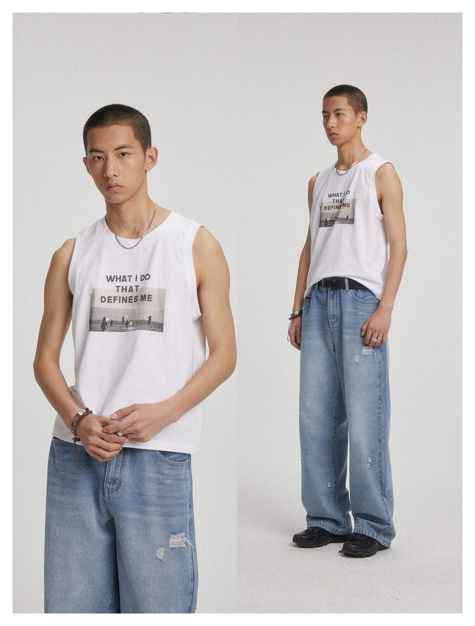 Model wearing the white graphic tank top with light-wash distressed jeans, shown in a close-up and a full-length view