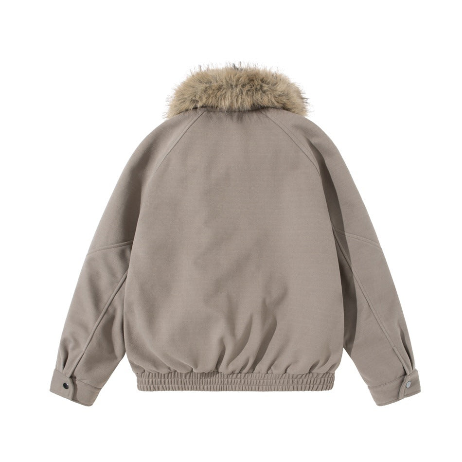 Back view of a taupe jacket with raglan sleeves, snap cuffs, a gathered hem, and a tan fur collar.