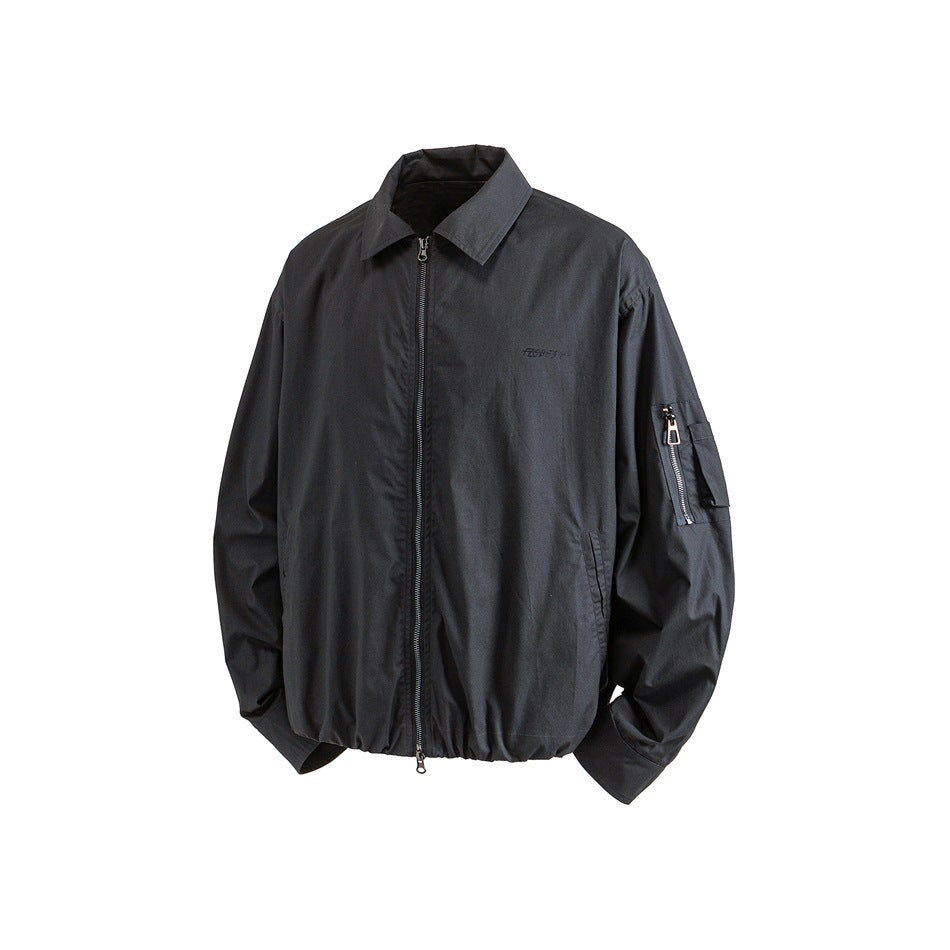Front view of a charcoal jacket with a pointed collar, full-length zipper, elastic hem, and zippered sleeve pocket.