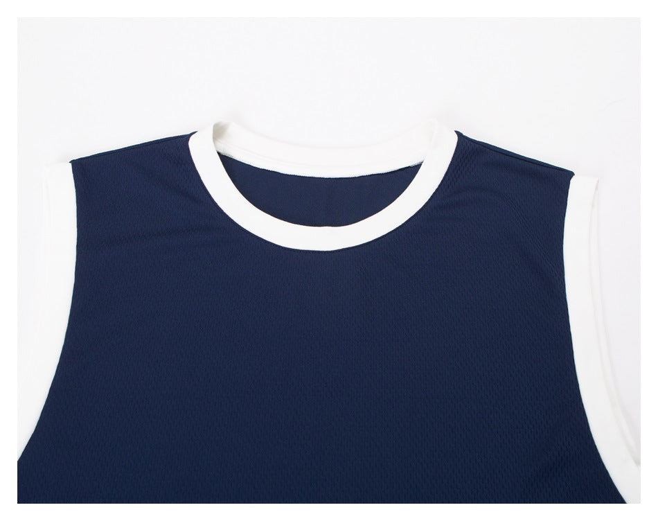 Close view of the front neckline and shoulders of a navy sleeveless top with white trim.