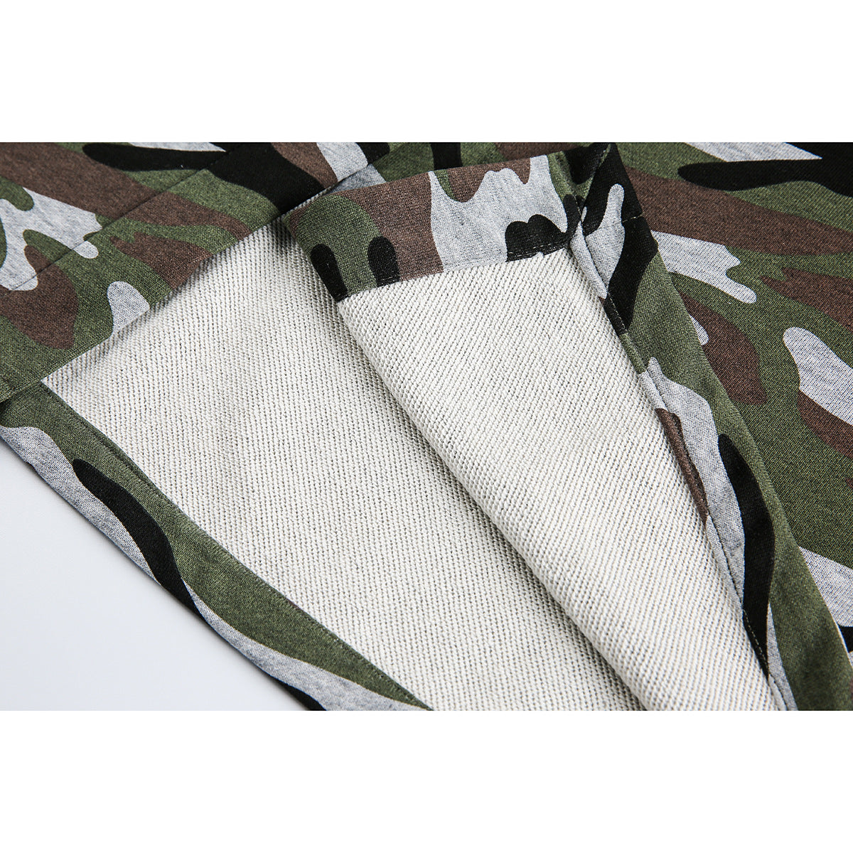 Close-up showing the skirt’s camouflage exterior and light-colored inner surface.