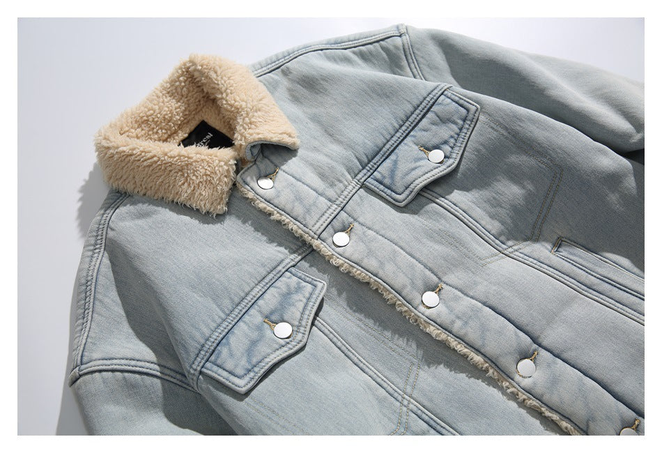Close view of the light blue jacket's sherpa collar, front snap buttons and flap chest pockets.