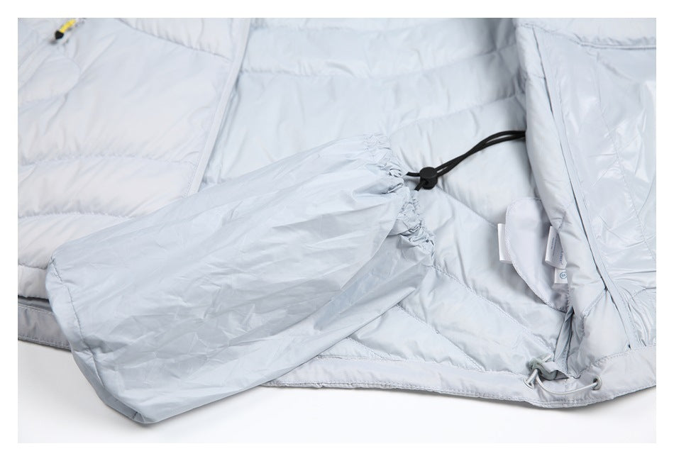 Inside view of the light gray jacket showing a loose fabric panel and black drawcord adjustment.