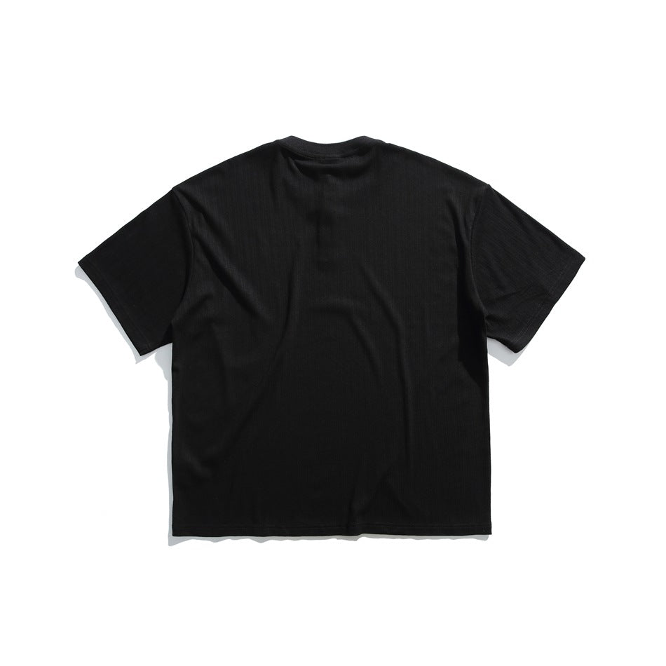 Back view of black short-sleeve T-shirt with round neckline and subtle vertical ribbed texture, flat lay
