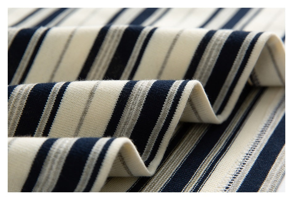 Close-up showing the striped fabric folded to reveal its texture and stitched edge.