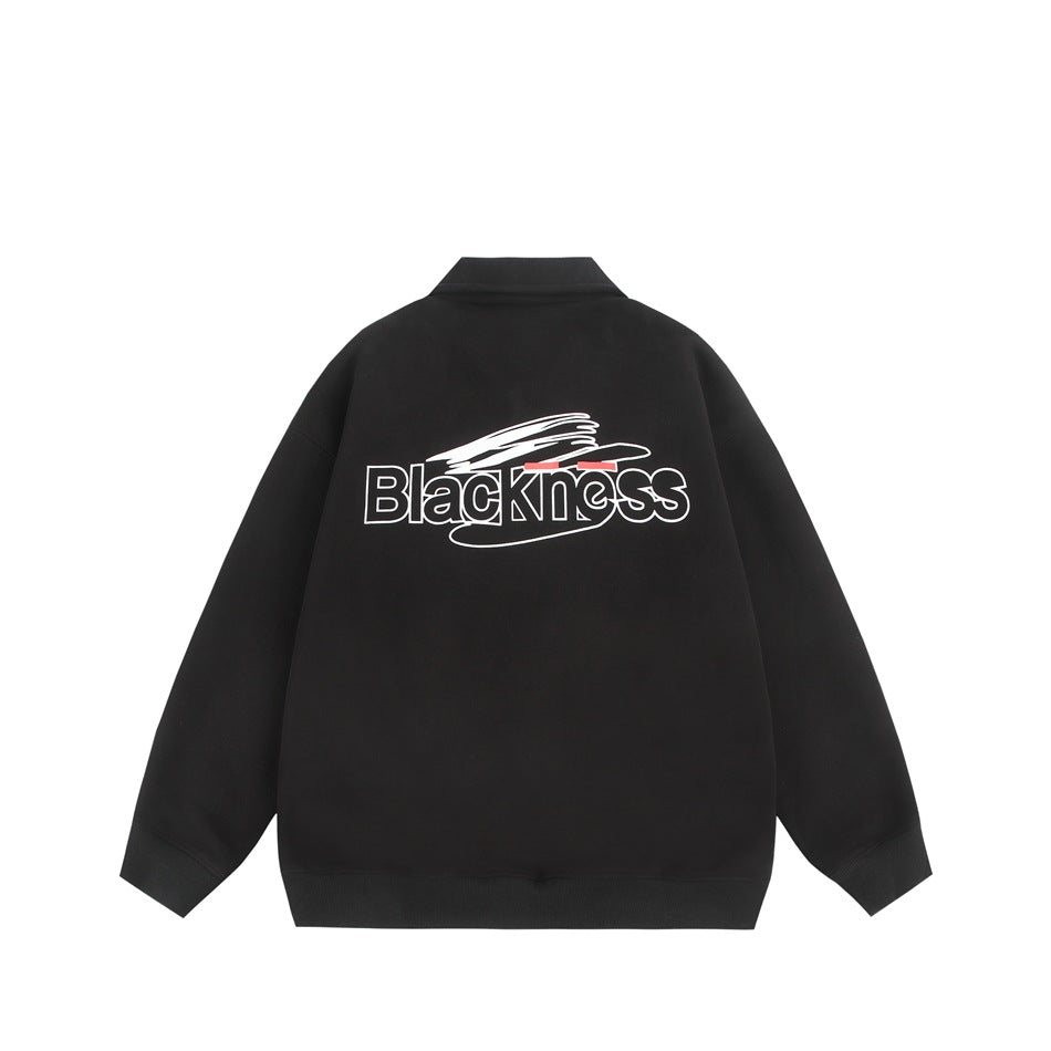 Back view of a black pullover sweatshirt with ribbed cuffs and hem and a white, outlined graphic with red accents.