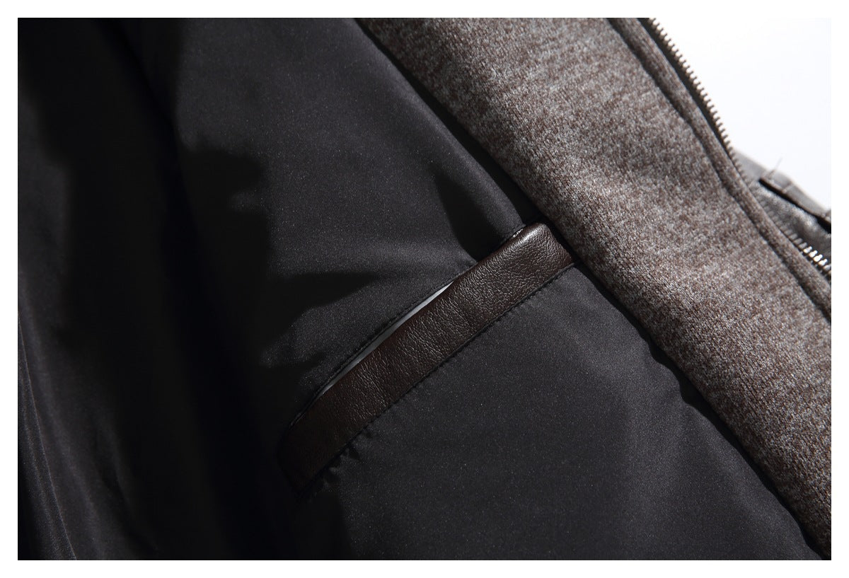Close-up of a dark jacket interior with black lining, brown trim, and a contrasting textured facing.