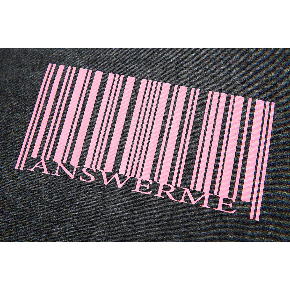 Close-up of a dark charcoal garment with a pink barcode-style graphic and the word “ANSWERME.”