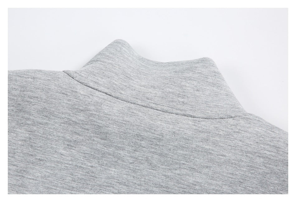 Close-up of the heather gray garment's collar and neckline seam.