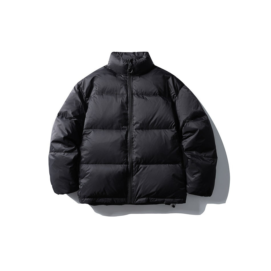 Black quilted puffer jacket with stand collar and front zipper, flat lay front view