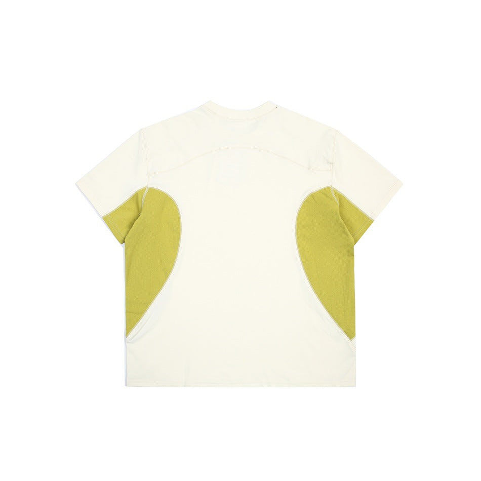 Back view of an ivory short-sleeve shirt with olive-yellow curved side panels.
