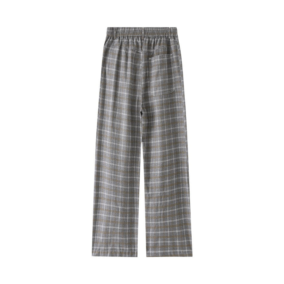 Back view of gray plaid wide-leg trousers with an elastic waistband and a single patch pocket.
