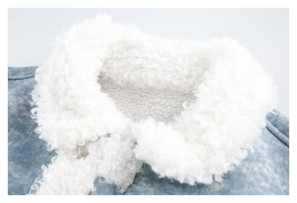 Close-up of the jacket's thick white curly fleece collar and blue mottled fabric.