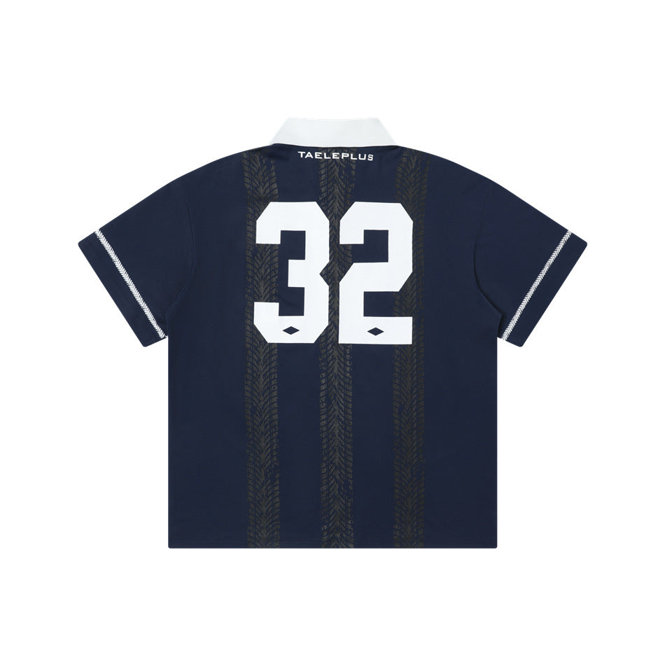 Navy blue polo jersey back view with large white 32 number over tire-tread stripes and white collar