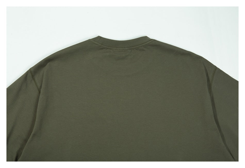 Back view of a plain dark olive-green crew-neck shirt laid flat.