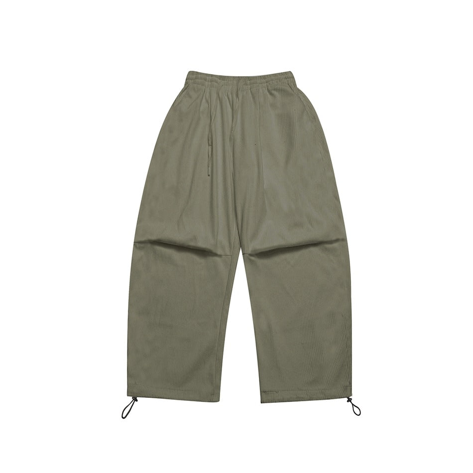 Olive green ribbed wide-leg pants flat lay with elastic drawstring waist and toggle hems