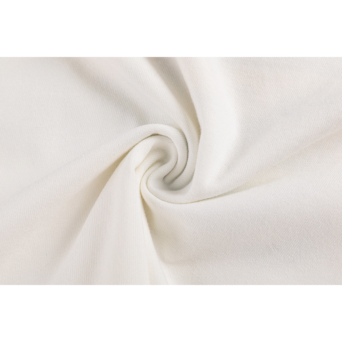 Close-up of off-white knit fabric gathered into a swirl.