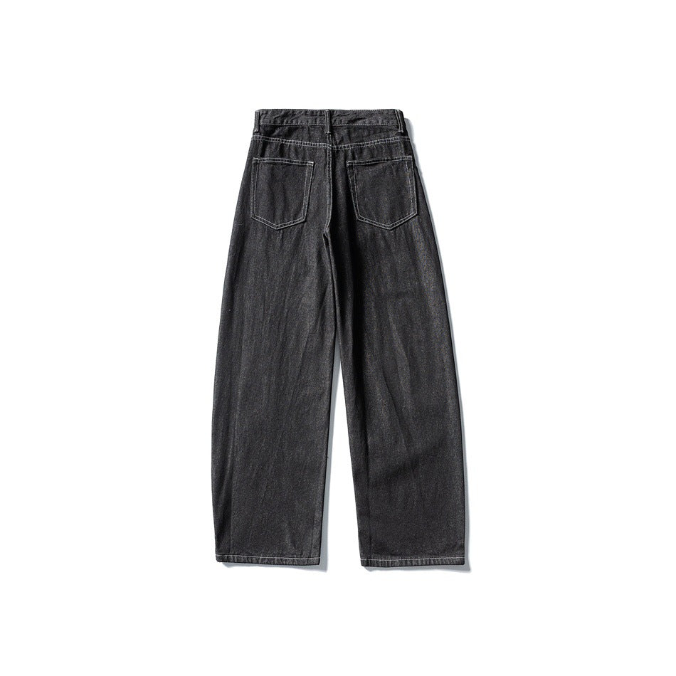 Back view of charcoal black wide-leg jeans with two patch pockets and a stitched waistband.