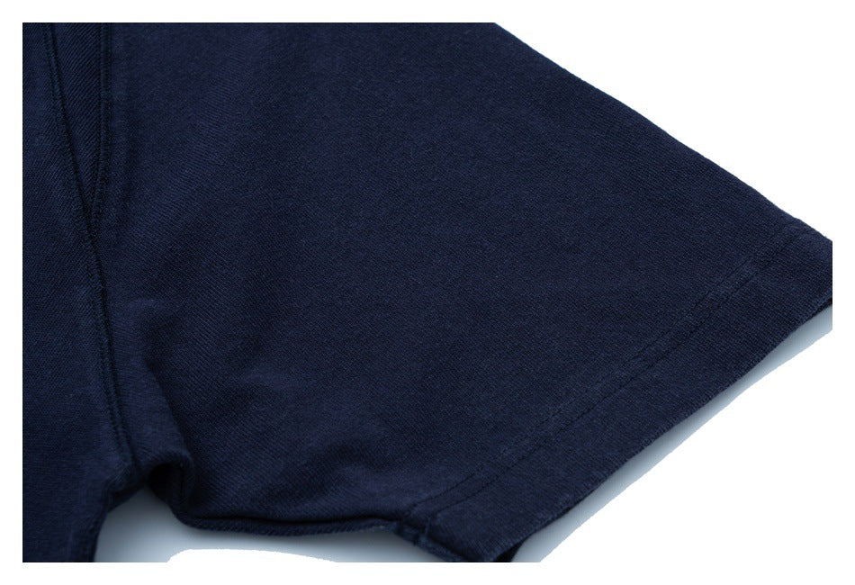 Close-up of a navy short sleeve and its stitched hem.