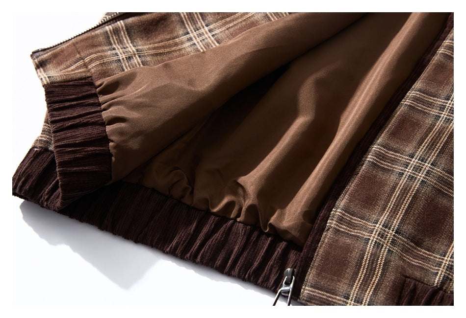 Interior close-up showing smooth brown lining, plaid outer fabric, ribbed edging, and a zipper.
