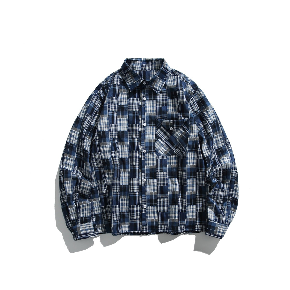 Navy blue patchwork plaid long-sleeve button-up shirt with collar and chest pocket, laid flat