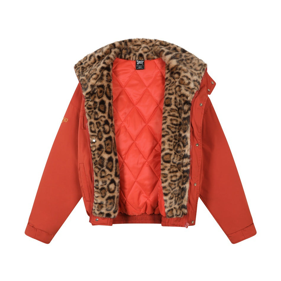 Open front view of a rust-red jacket with leopard-print collar and trim, showing its red diamond-quilted lining.