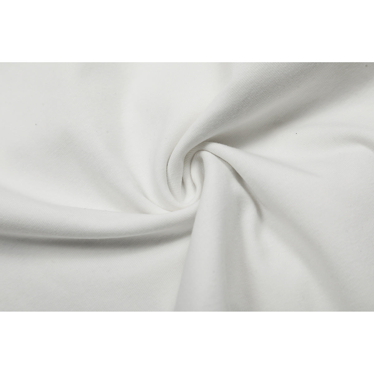 Close-up of plain white fabric arranged in soft folds.