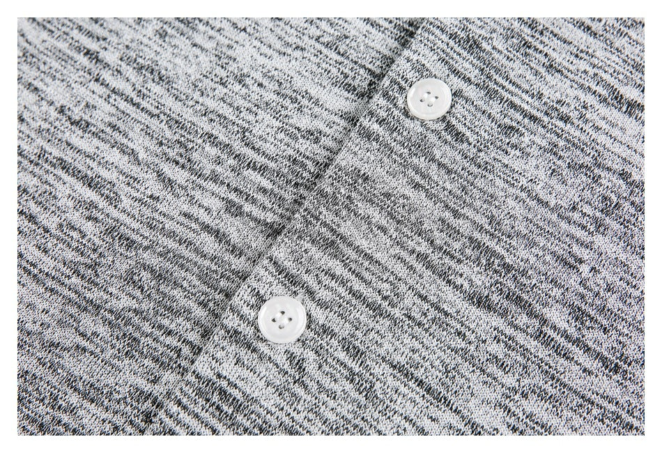 Close-up of a black, gray, and white marled knit placket with two white buttons.